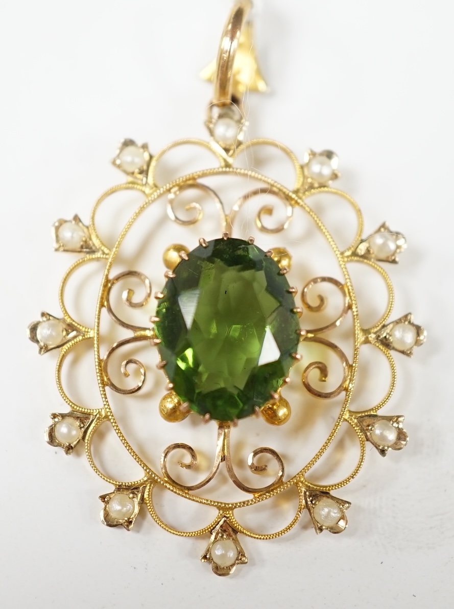 An early 20th century style 9ct, green paste and seed pearl set oval open work pendant, 38mm, 3.5 grams. Condition - good